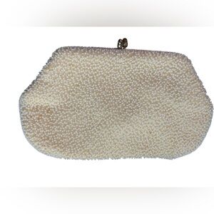Elegant Cream Clutch with Textured Finish and Classic Frame